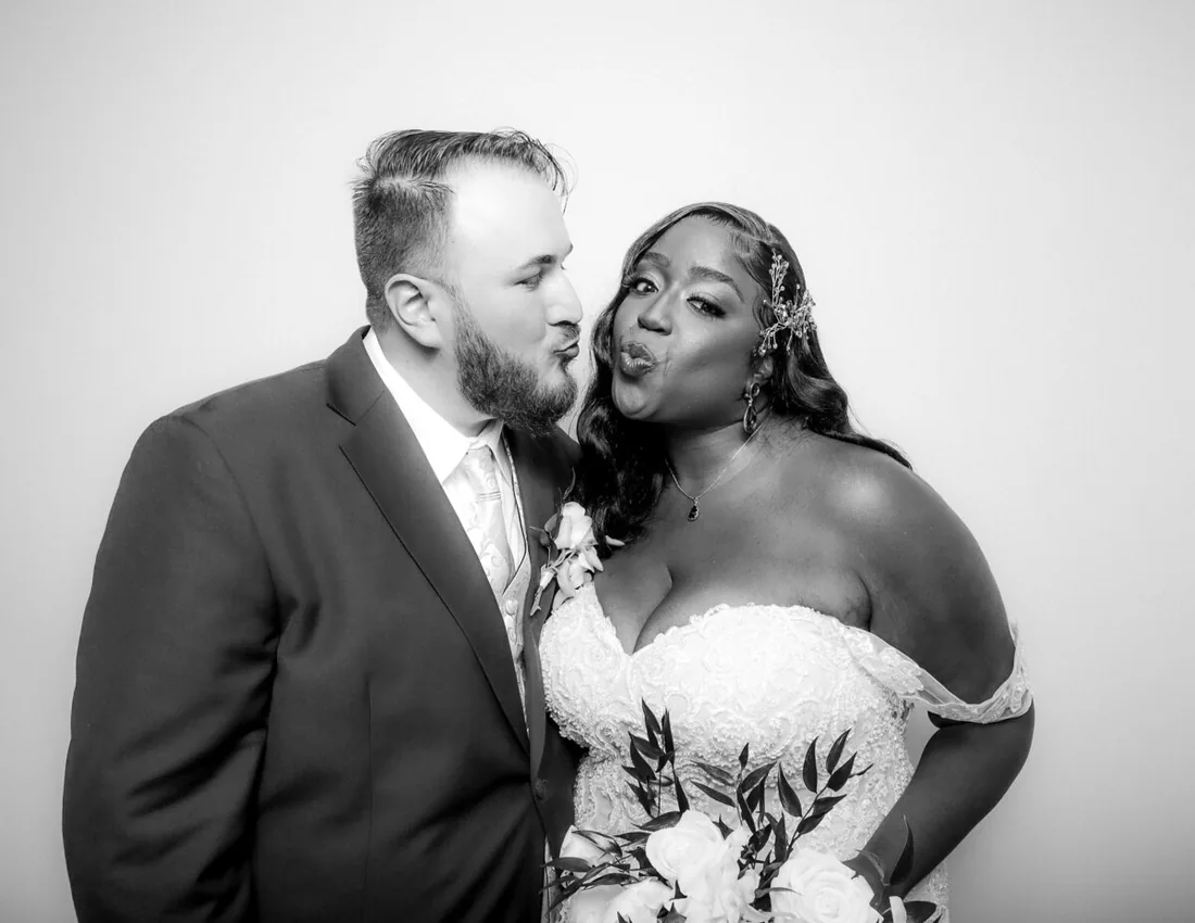 Full-service open-air photo booth set up with professional lighting at an Orlando wedding venue